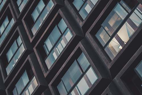 office building low angle photo of buildings window